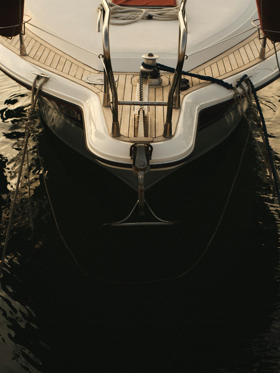 a-white-and-black-boat-in-a-body-of-water-9n8gfv5eua0