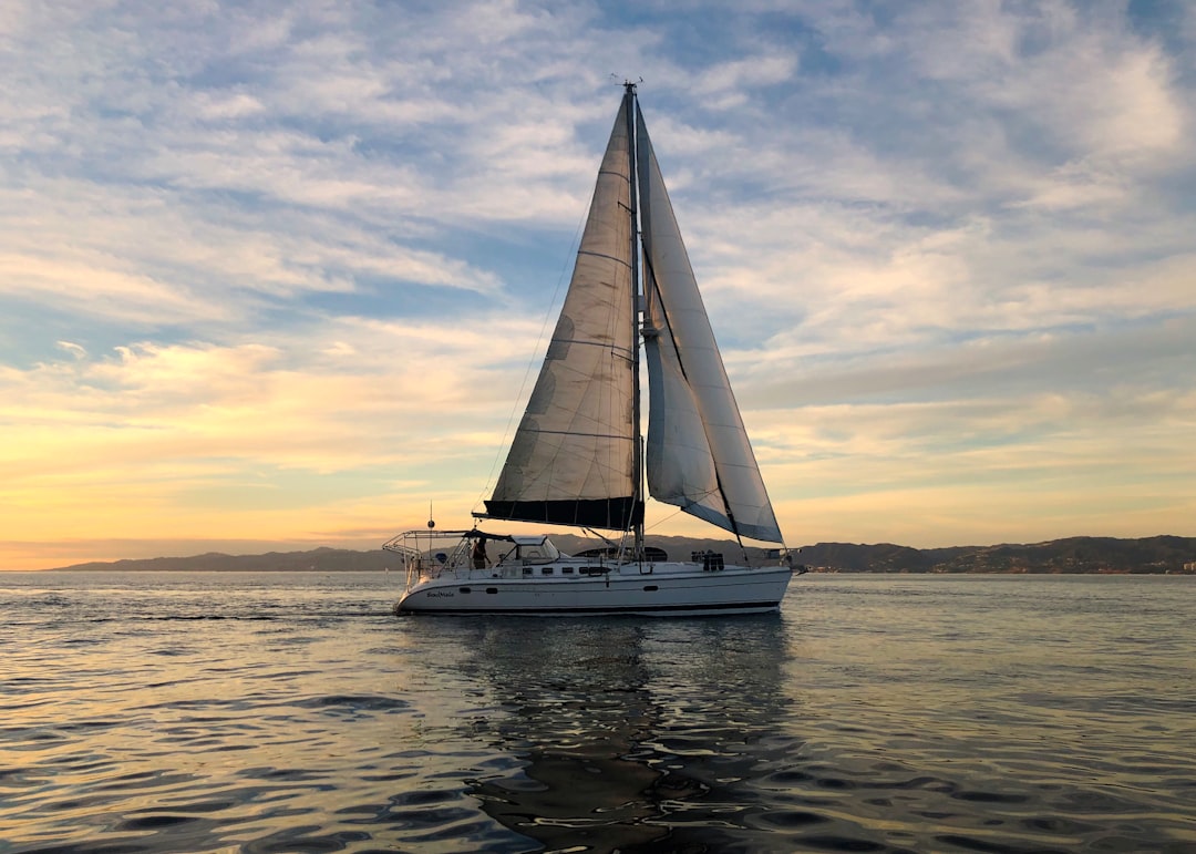 white-sail-boat-on-sea-during-daytime-qldvyvbhy